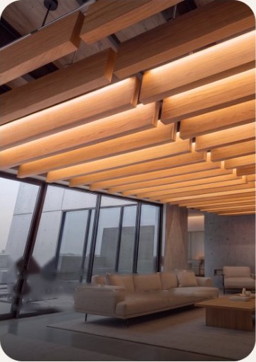 Wood ceiling baffles over a lounge